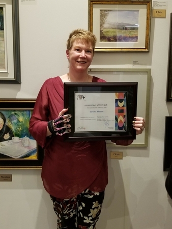 Sandra Woods with her First Prize watercolour painting, in the 2022 Pierrefonds Art Contest